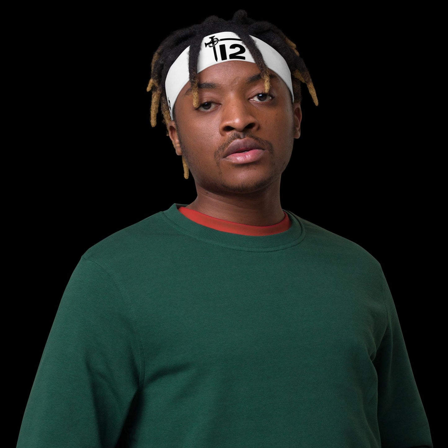 White Christian Headband – All-over print athletic headband featuring bold black “12T” logo with cross nail and crown of thorns, faith-based sportswear modeled by man in green sweatshirt.