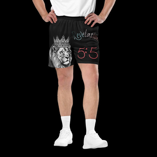 Revelation 5:5 Christian Mesh Shorts – Black unisex athletic shorts featuring crowned lion illustration and Bible verse design, bold faith-based activewear modeled by man in white sneakers and tee.