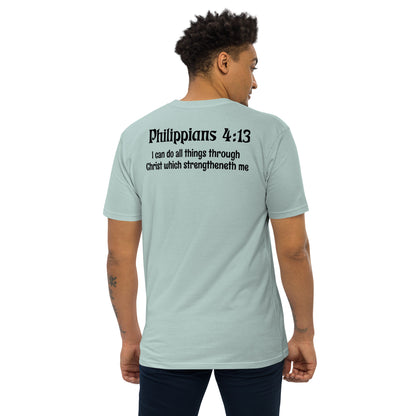 Agave Green Christian T-Shirt – Men’s premium heavyweight tee featuring “Philippians 4:13” Bible verse on the back: “I can do all things through Christ which strengtheneth me,” faith-based apparel modeled by man in navy pants.